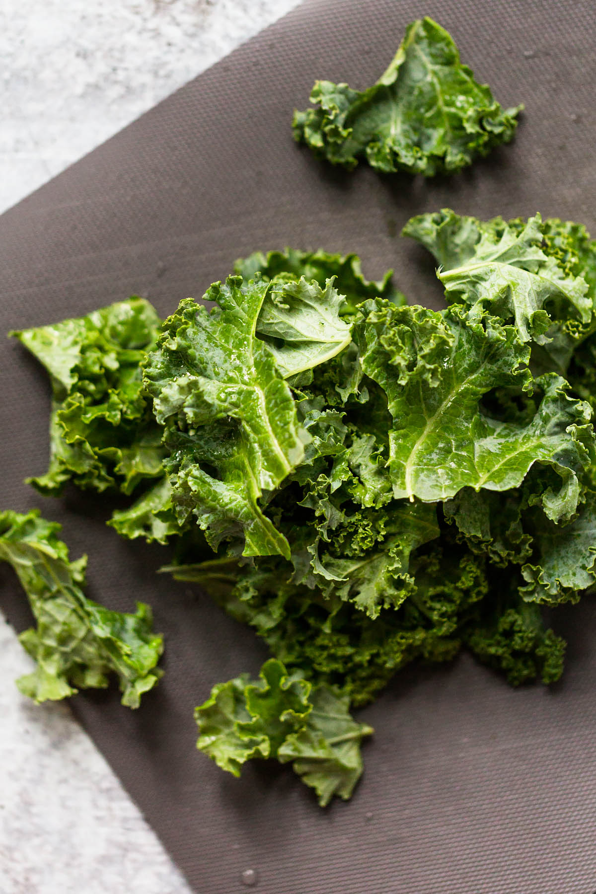 cut curly kale on a cutting board