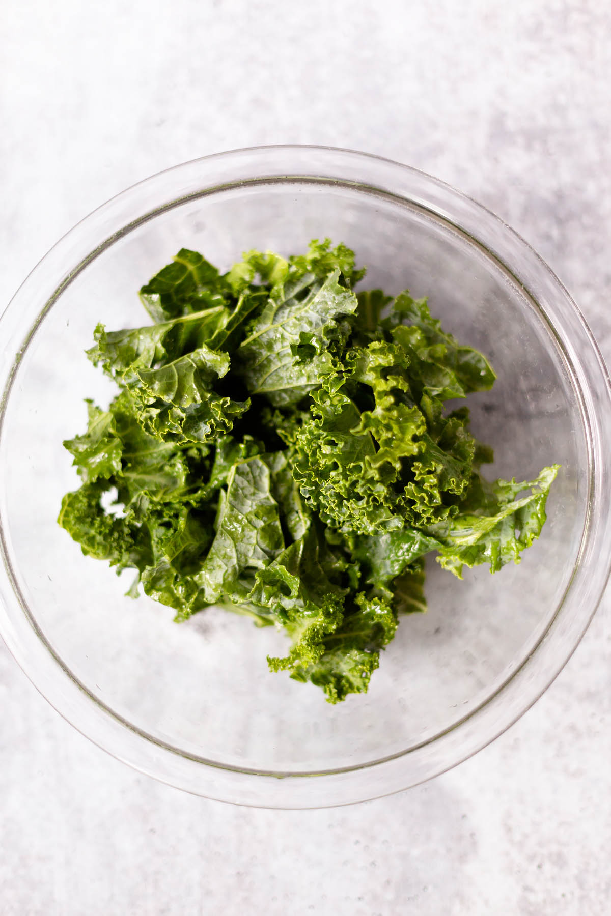 curly kale in a clear bowl