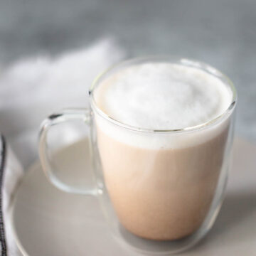 french press latte in a glass mug