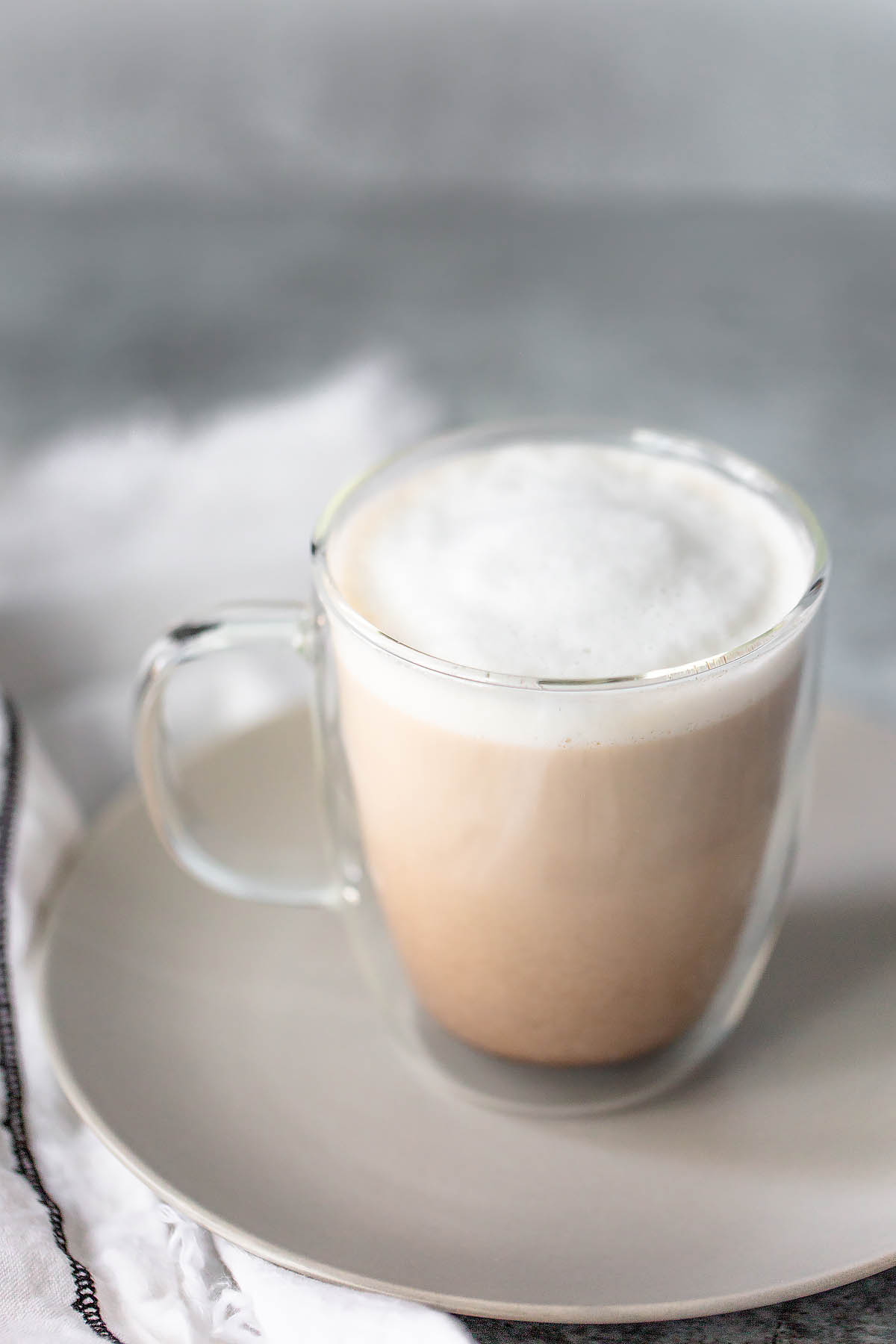 french press latte in a glass mug