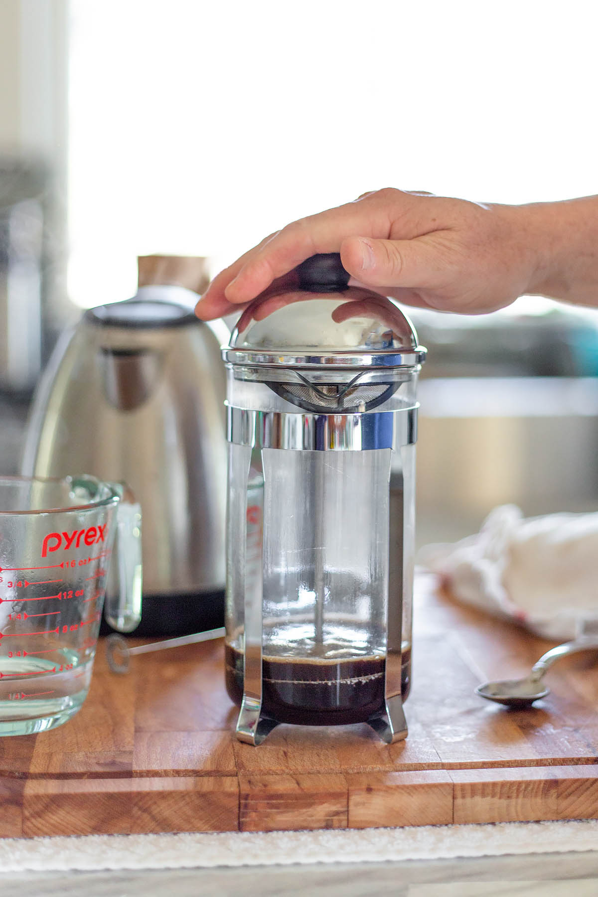 pressing down a french press