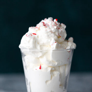 homemade peppermint whipped cream topped with peppermint pieces