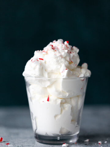 homemade peppermint whipped cream topped with peppermint pieces