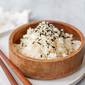 rice in a bowl with chopsticks