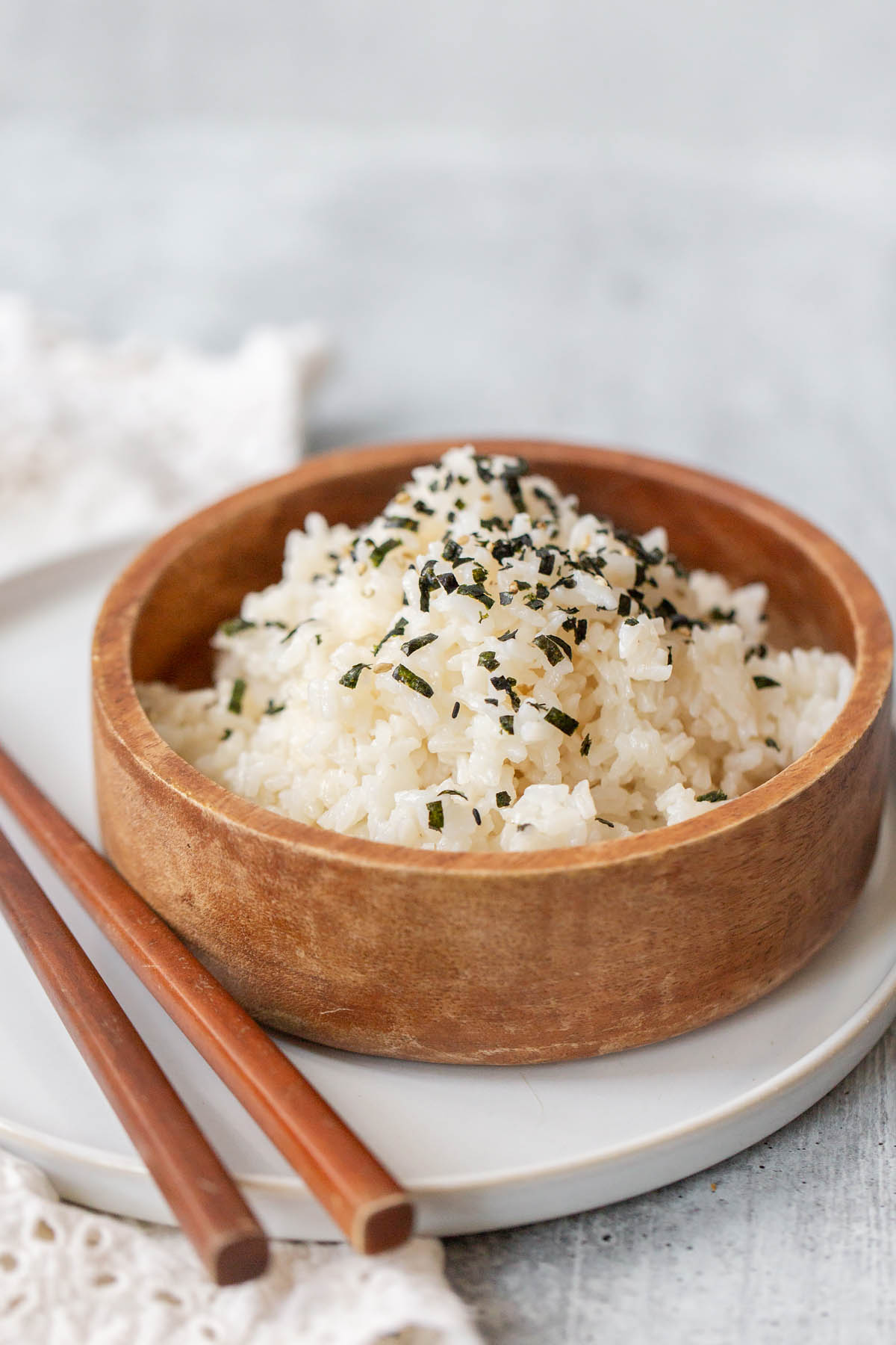 rice in a bowl with chopsticks