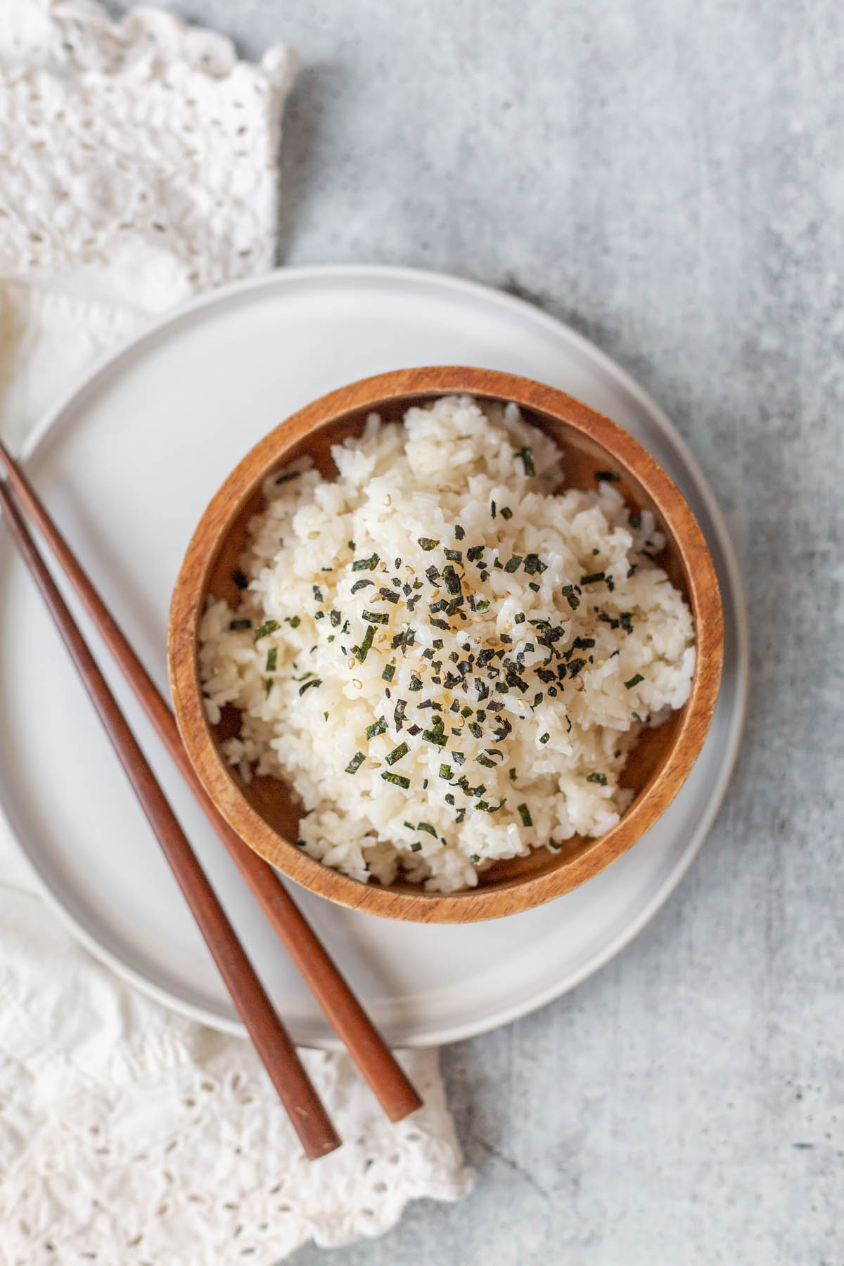 sesame rice in a bowl with chopsticks