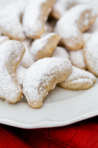 walnut crescent cookies on a plate