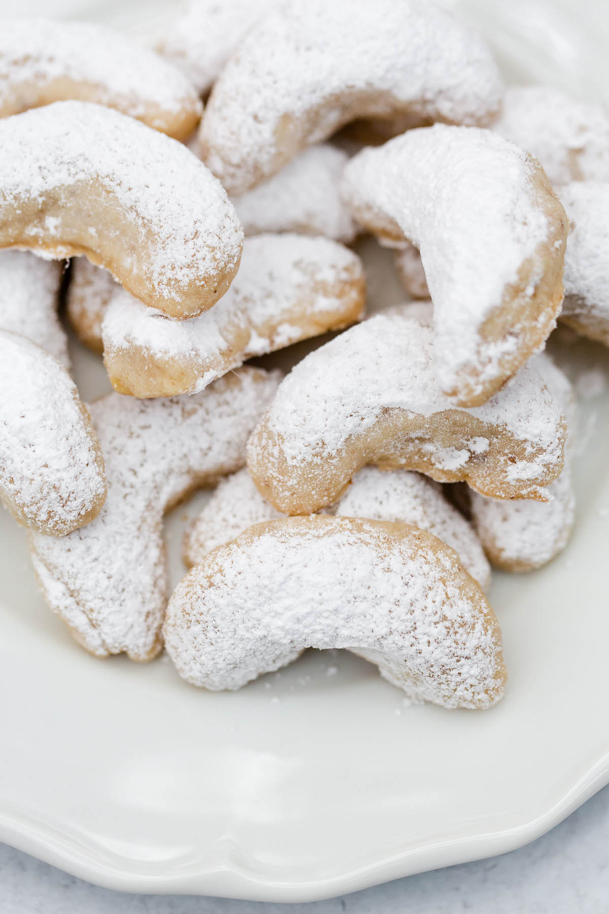 walnut crescent cookies dusted with powdered sugar