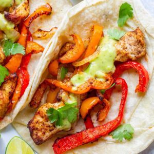 Air fried chicken fajitas on a plate.