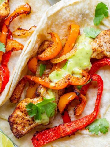 Air fried chicken fajitas on a plate.