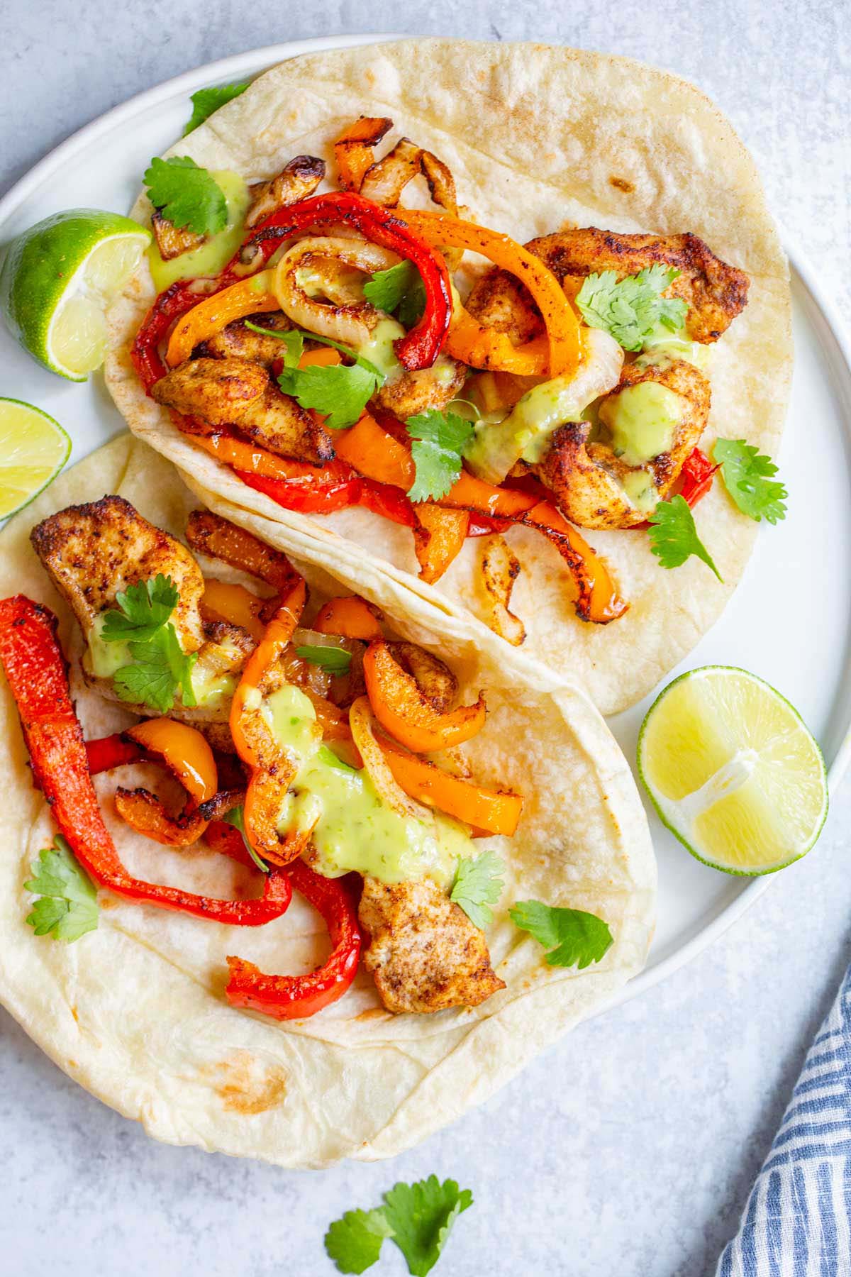 Air fried chicken fajitas on a plate.