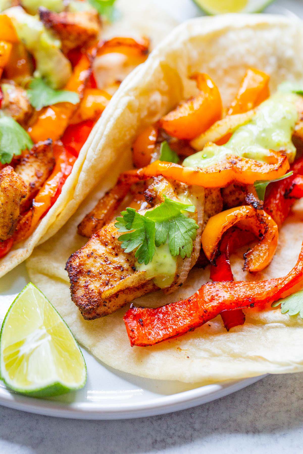 Air fried chicken fajitas on a plate.