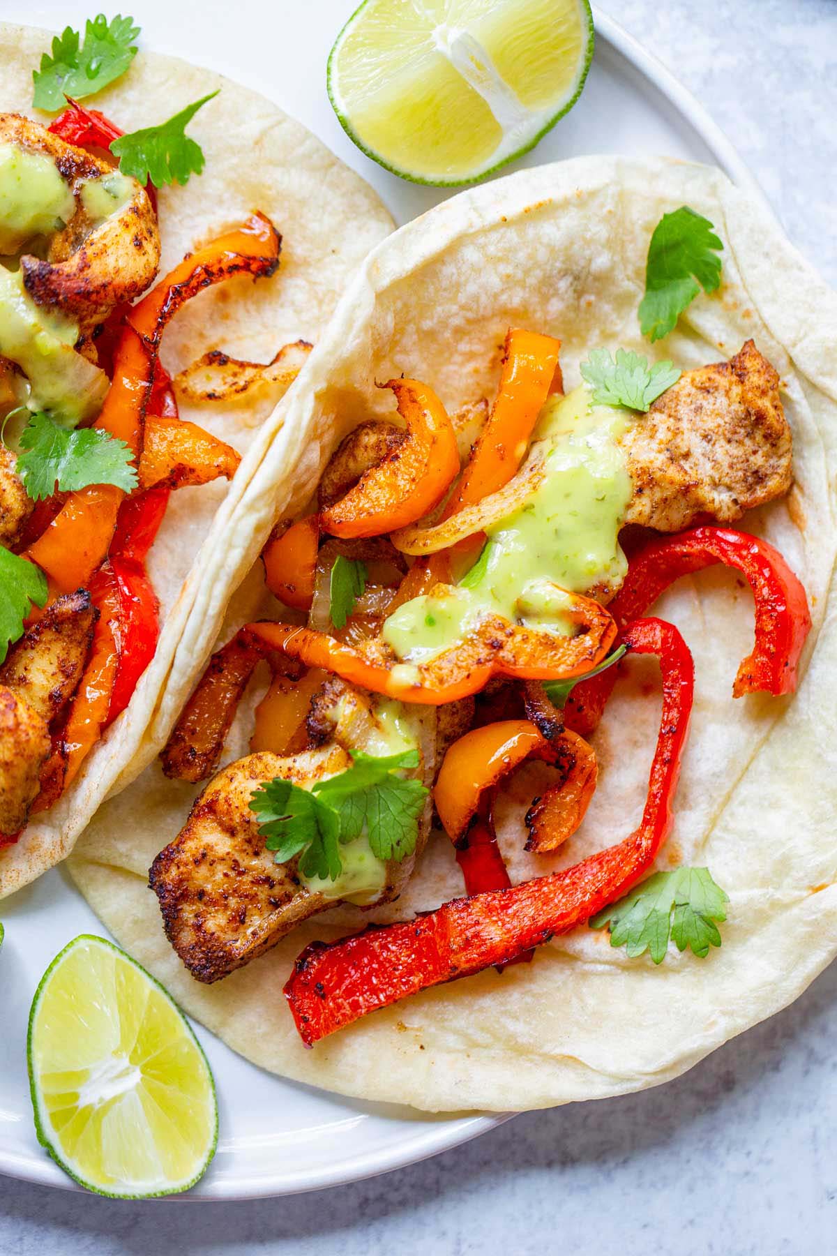 Air fried chicken fajitas on a plate.