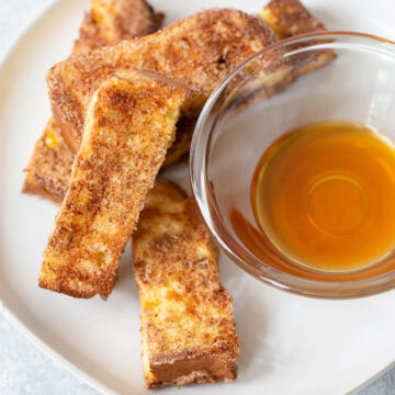 Air fryer french toast sticks with syrup on the side