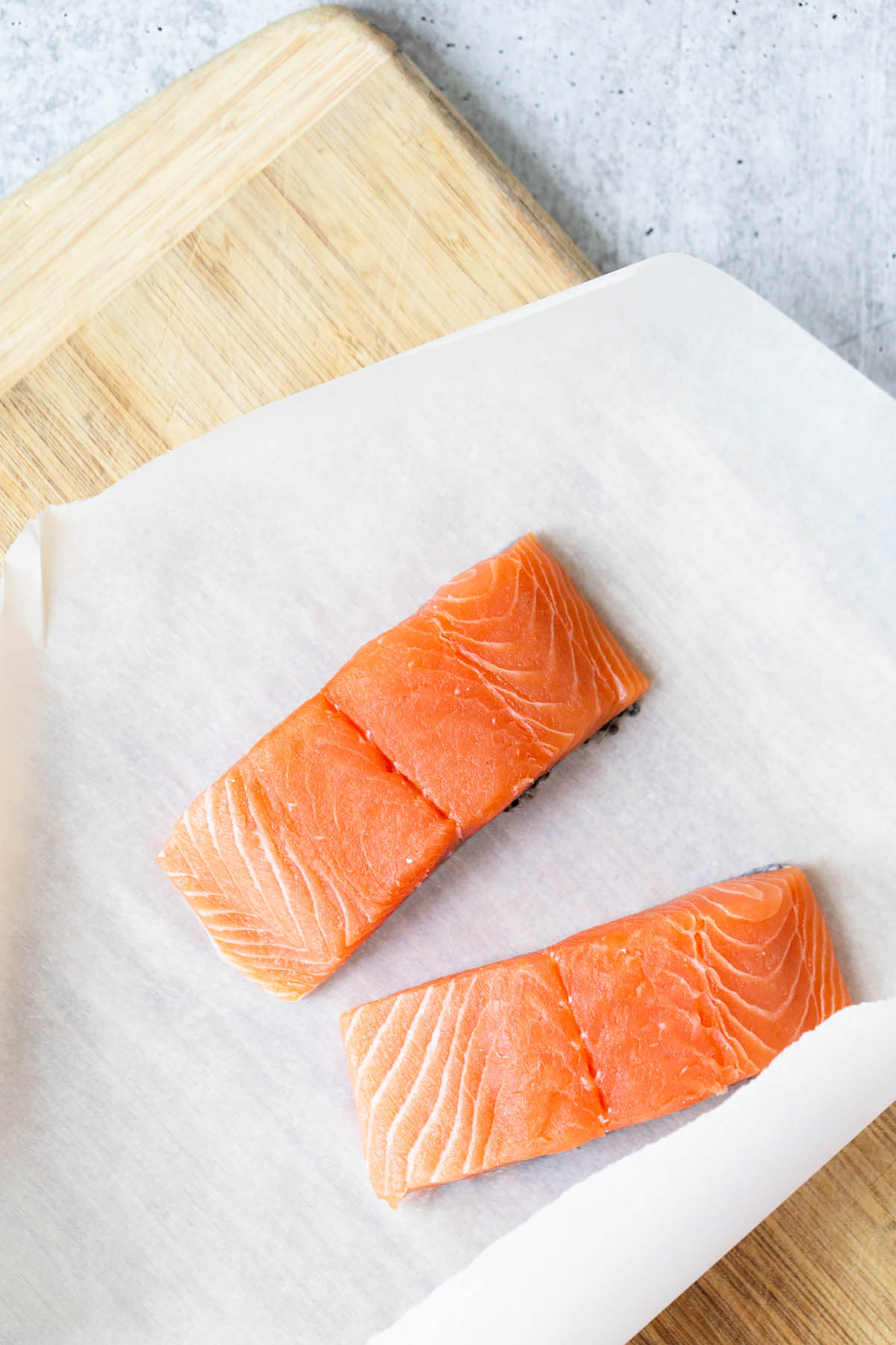 raw salmon on parchment paper