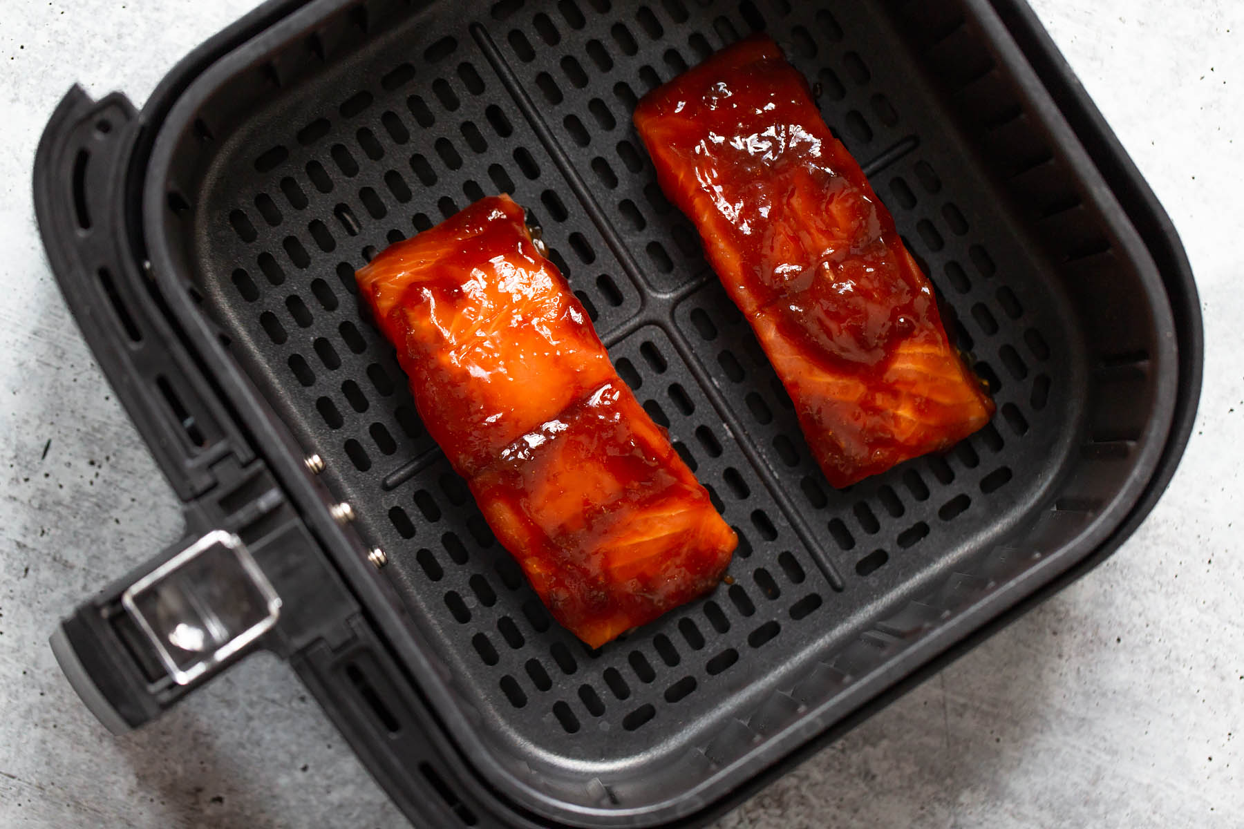 teriyaki salmon in the air fryer basket