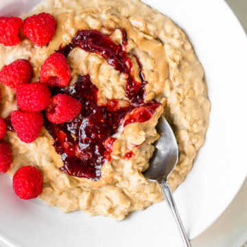 peanut butter and jelly oatmeal with raspberries on top