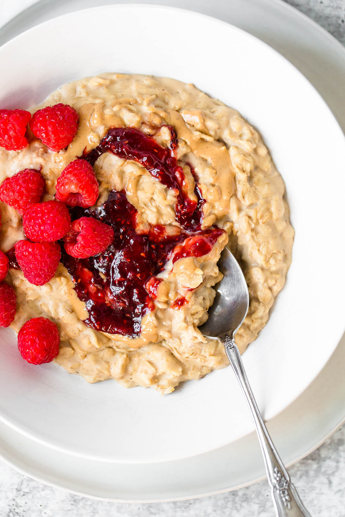 peanut butter and jelly oatmeal with raspberries on top