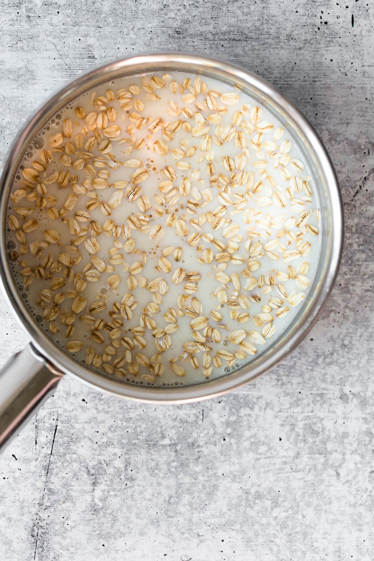 oats and almond milk in a pot