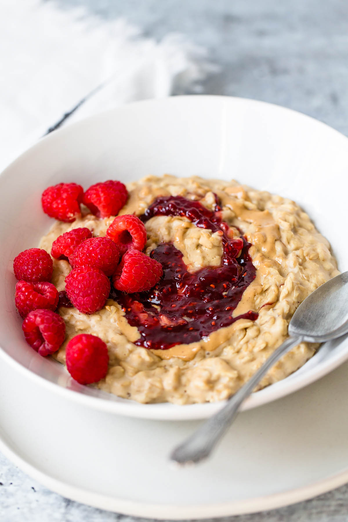 peanut butter and jelly oatmeal with raspberries on top