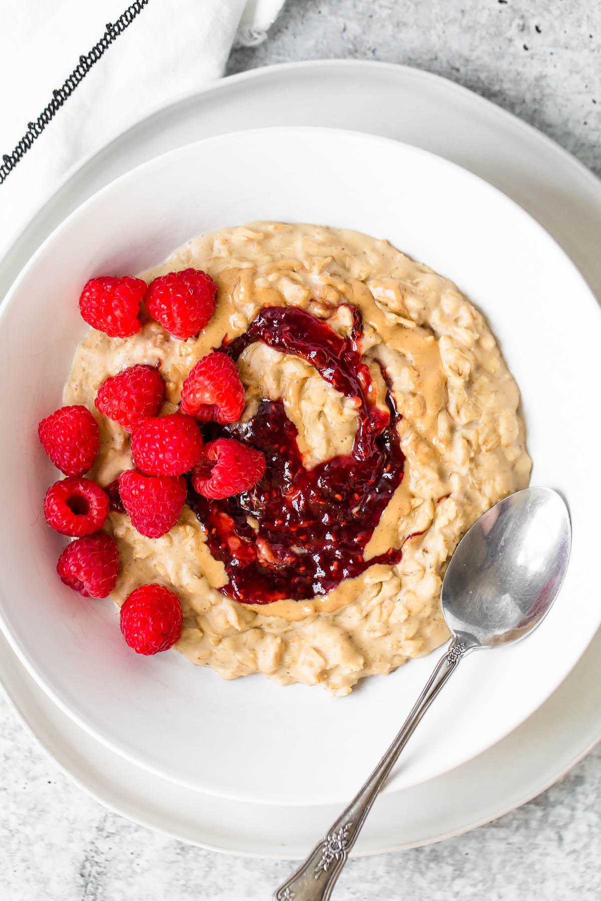 peanut butter and jelly oatmeal with raspberries on top