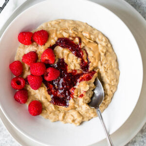 Peanut butter and jelly oatmeal with fresh raspberries