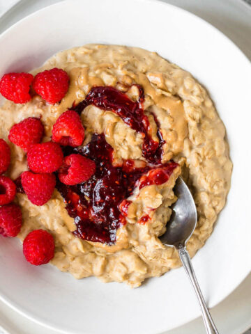 Peanut butter and jelly oatmeal with fresh raspberries