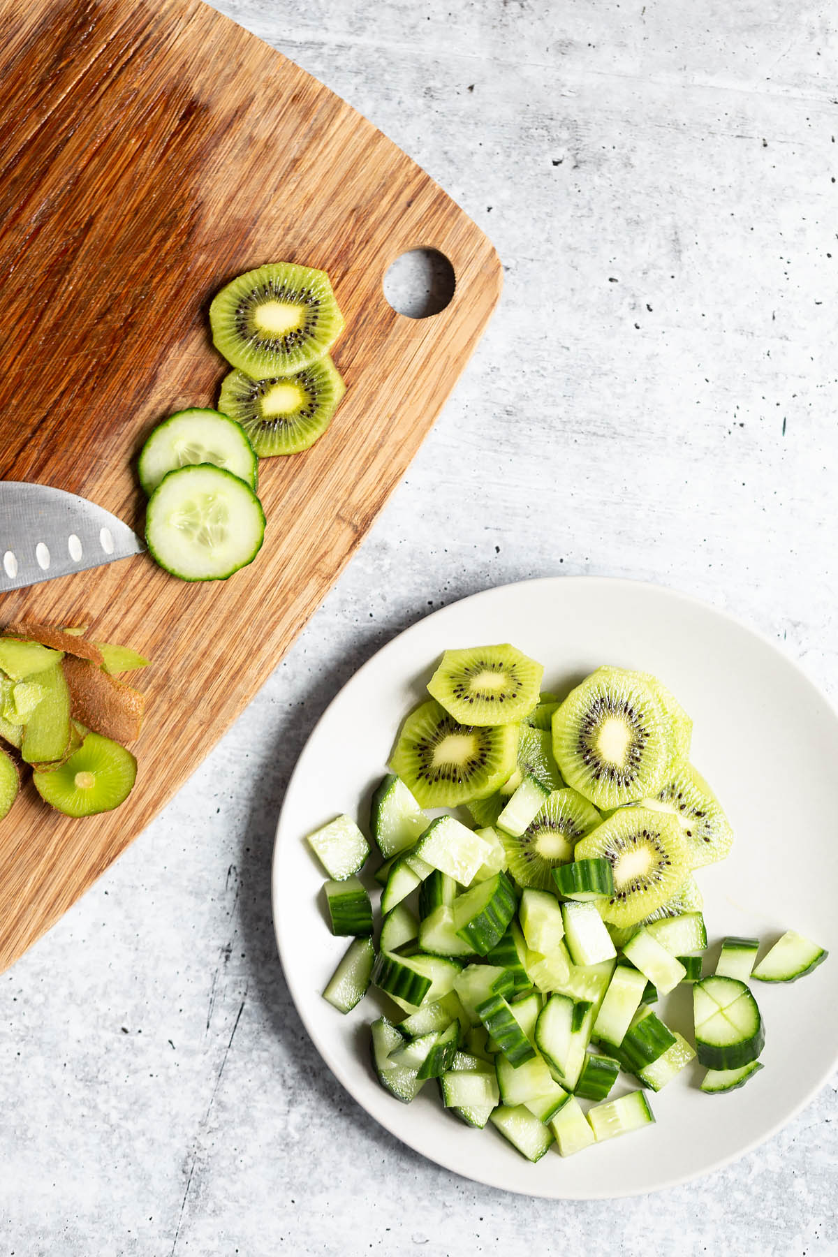 slicing cucumbers and kiwi