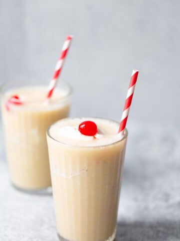 pineapple banana smoothie with a cherry