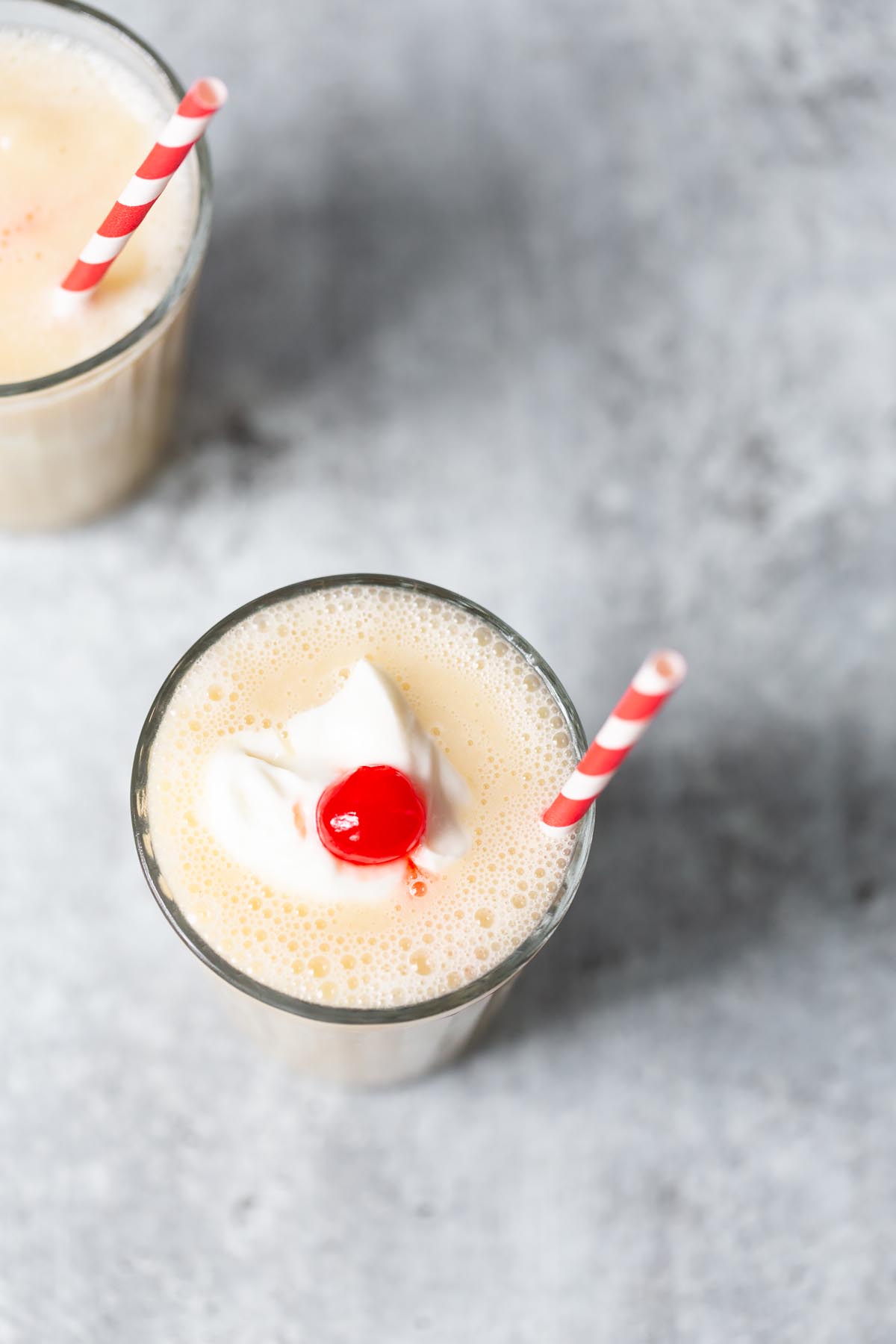 pineapple and banana smoothie with a cherry on top