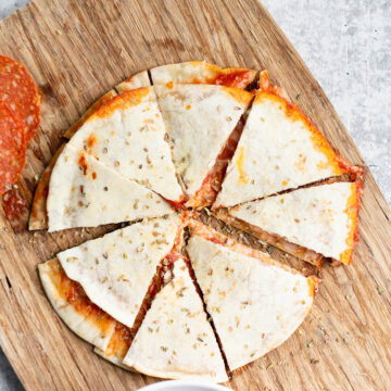 pizza quesadilla on a cutting board