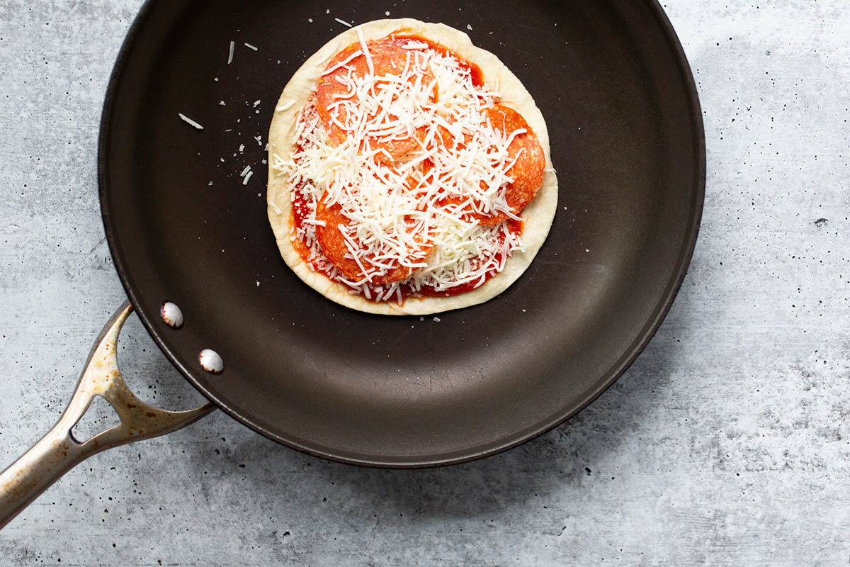 making a pizza quesadilla