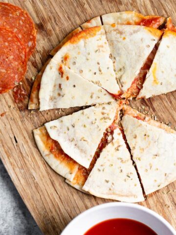 pepperoni pizza quesadilla on a cutting board