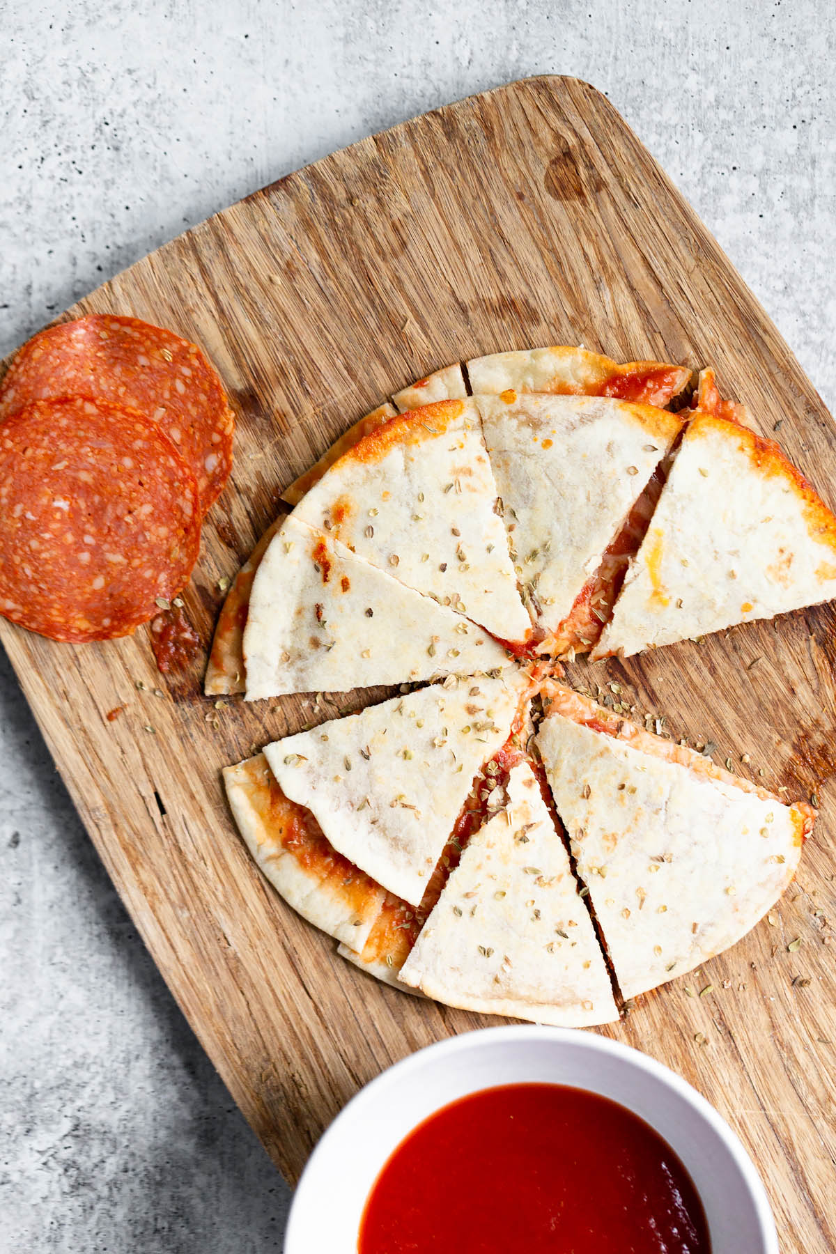 pizza quesadilla on a cutting board