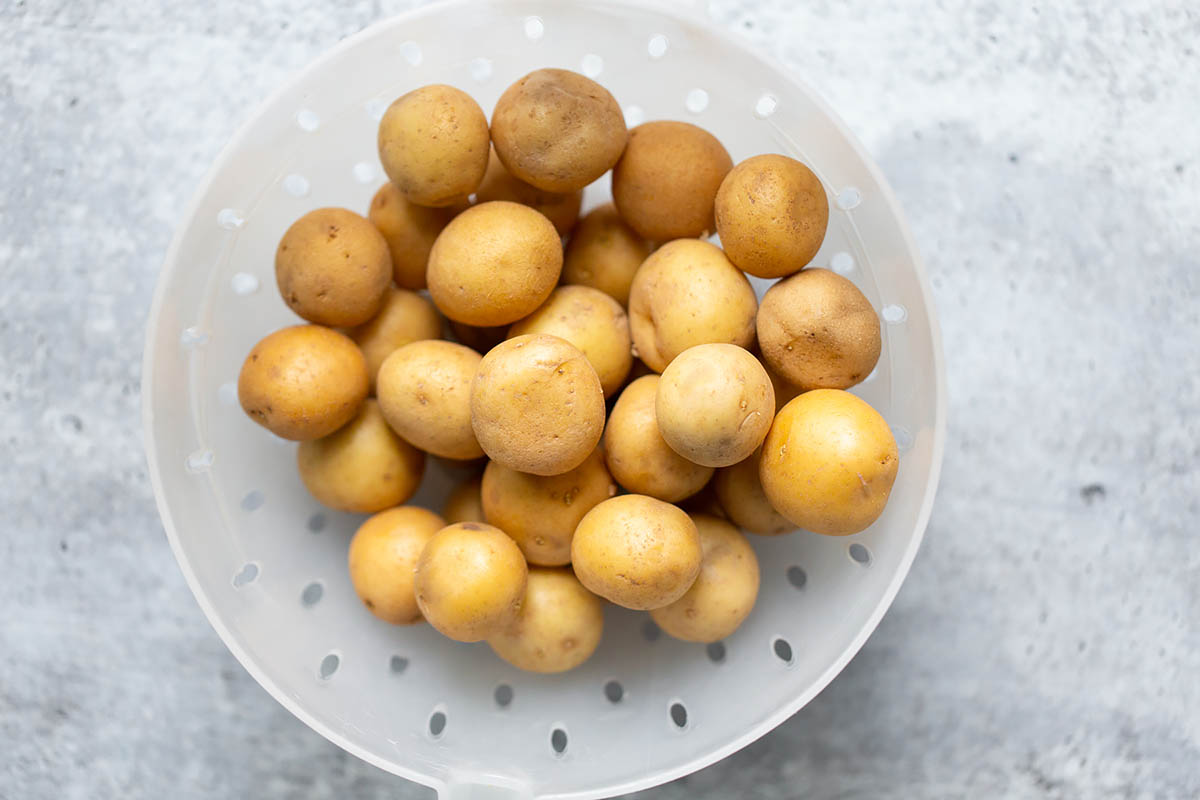 baby potatoes in a strainer