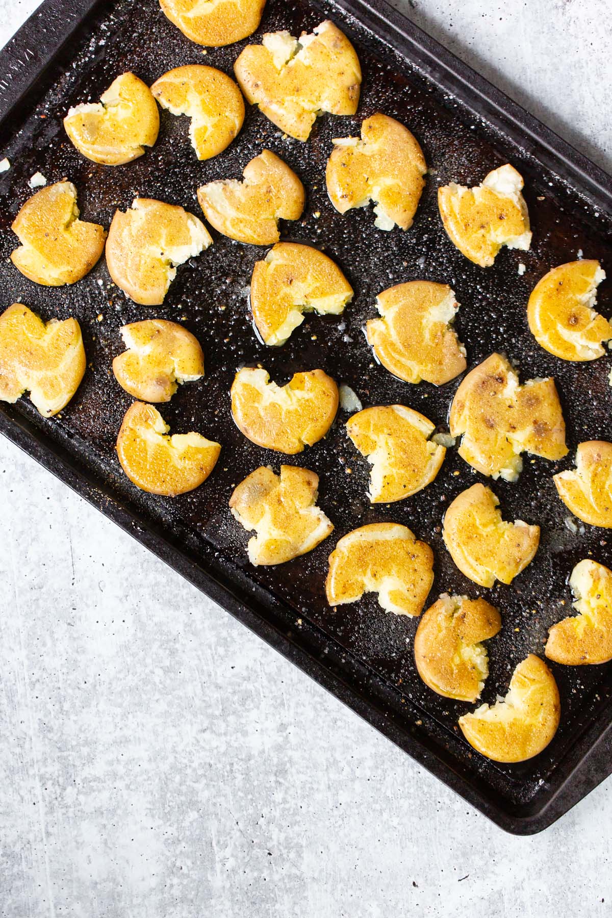 smashed potatoes on a sheet pan