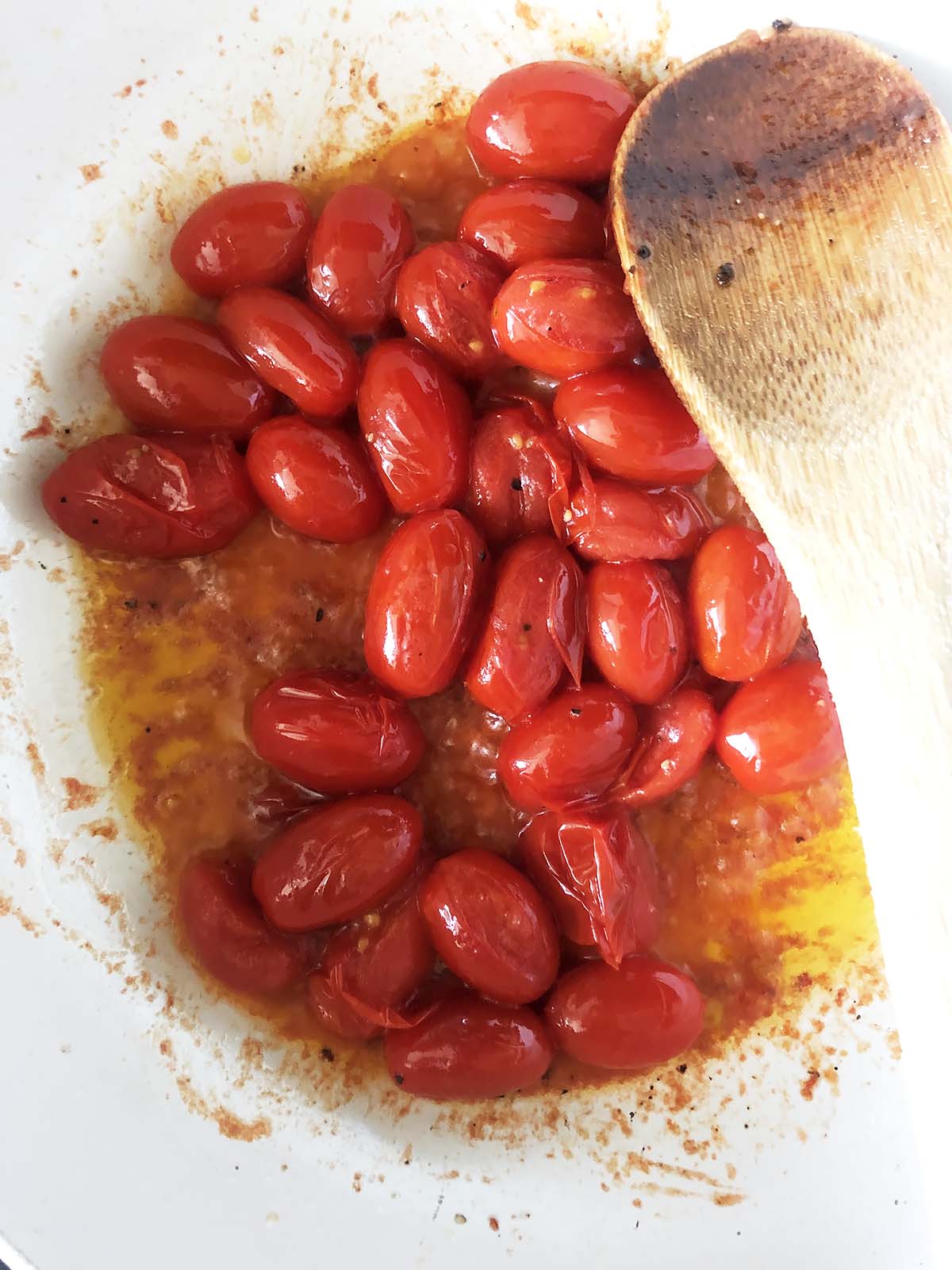 tomatoes cooking in a pan