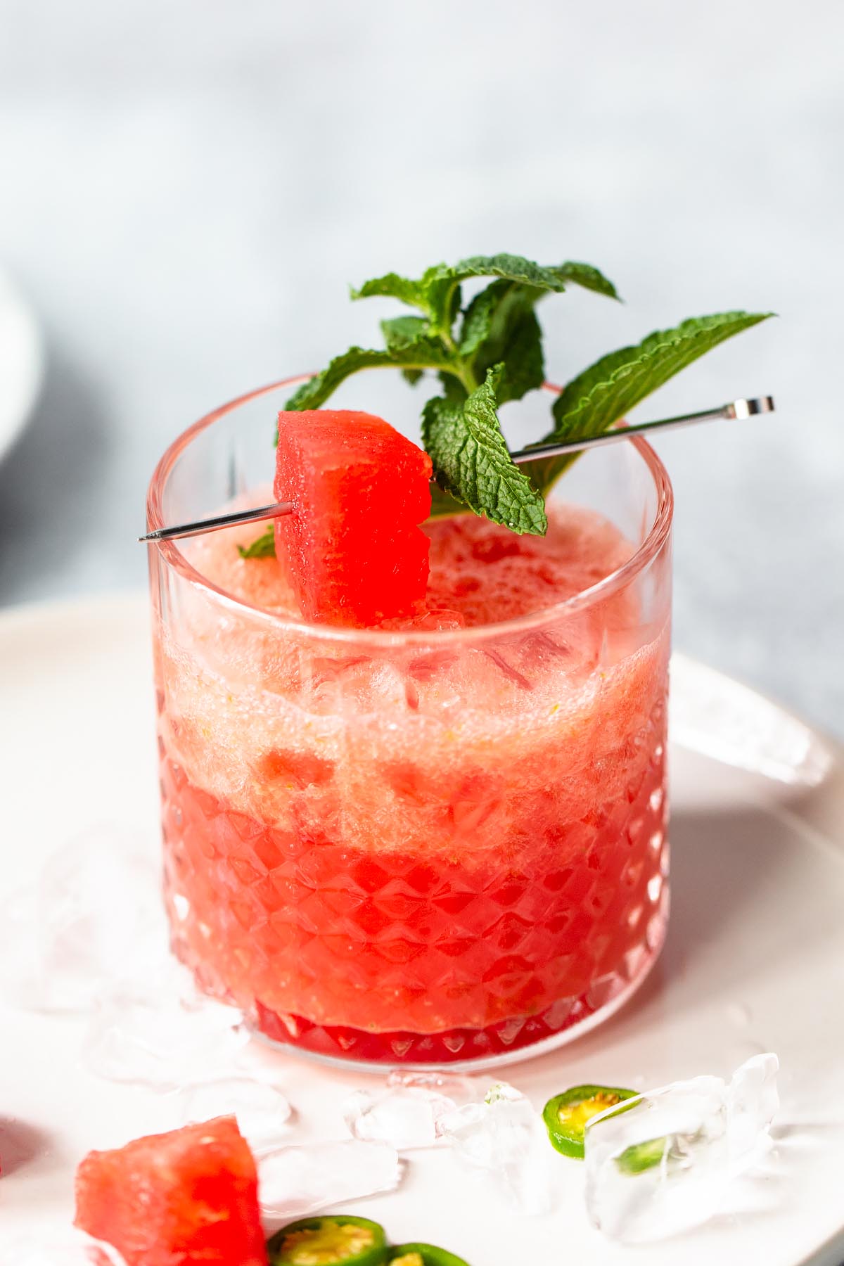 watermelon mocktail up close with a watermelon and mint garnish