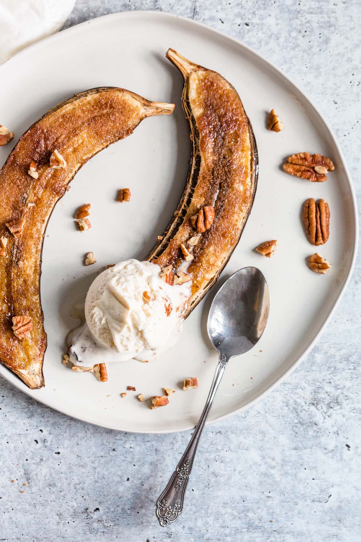 air fryer banana with a scoop of vanilla ice cream