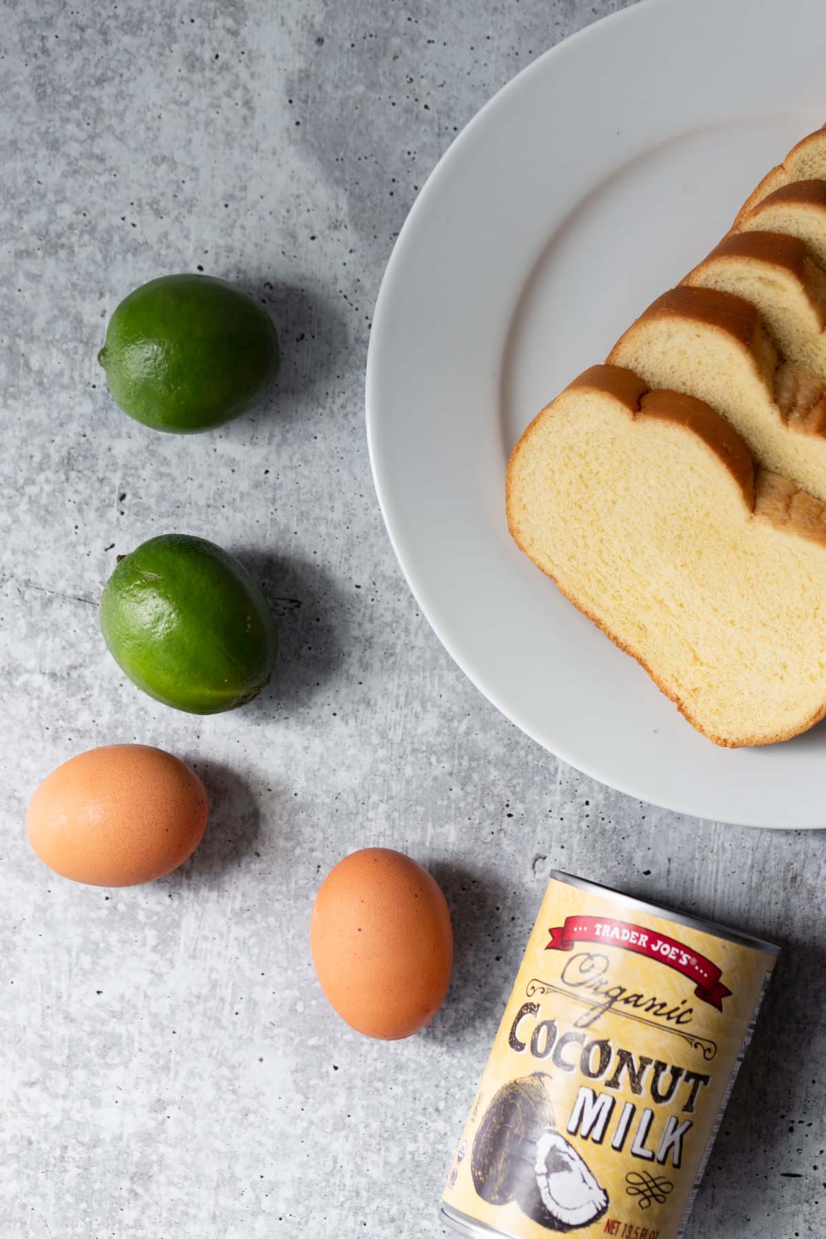 brioche bread, limes, eggs, and a can of coconut milk