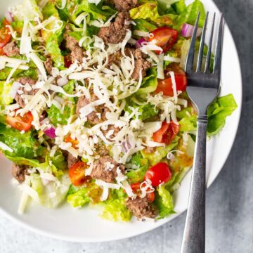 salad up close with shredded cheese on top