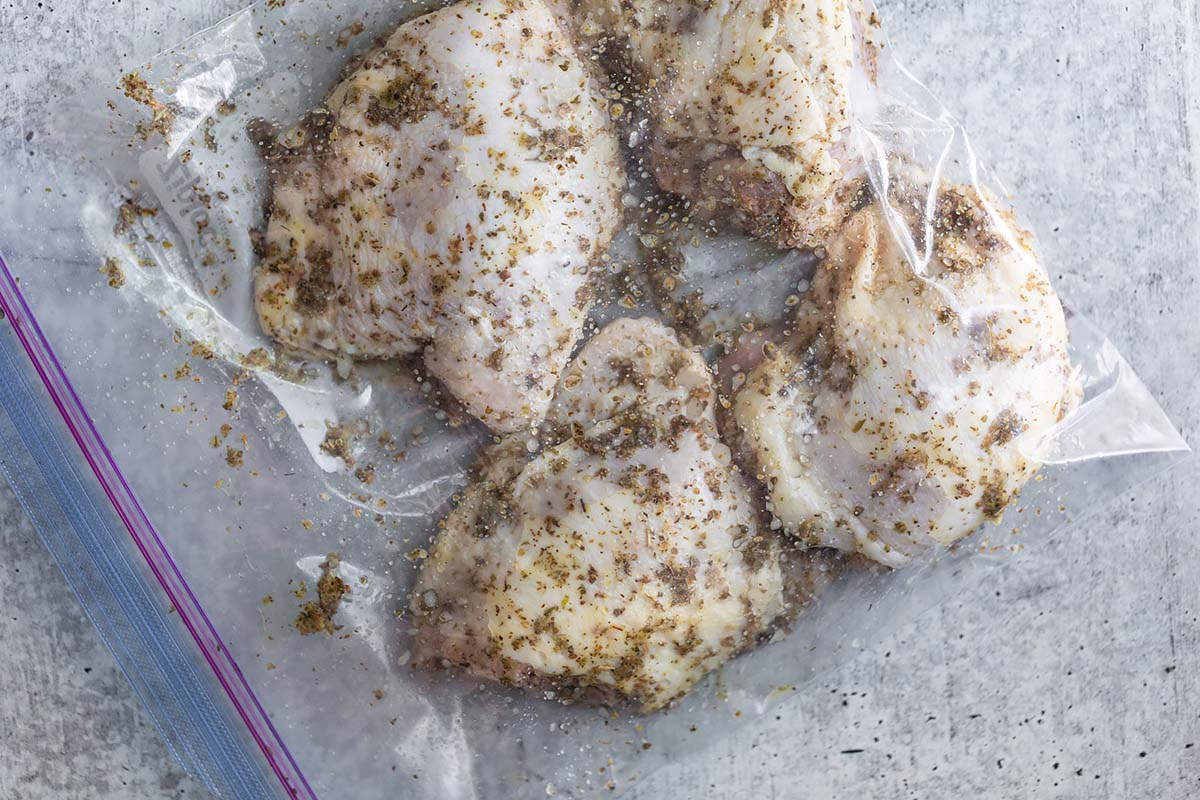 chicken thighs marinating in a bag