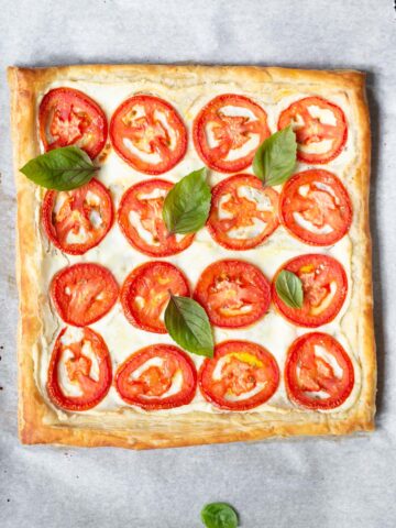 tomato and ricotta tart topped with fresh basil