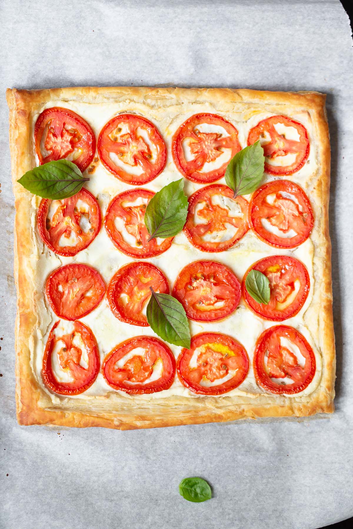 tomato and ricotta tart topped with fresh basil