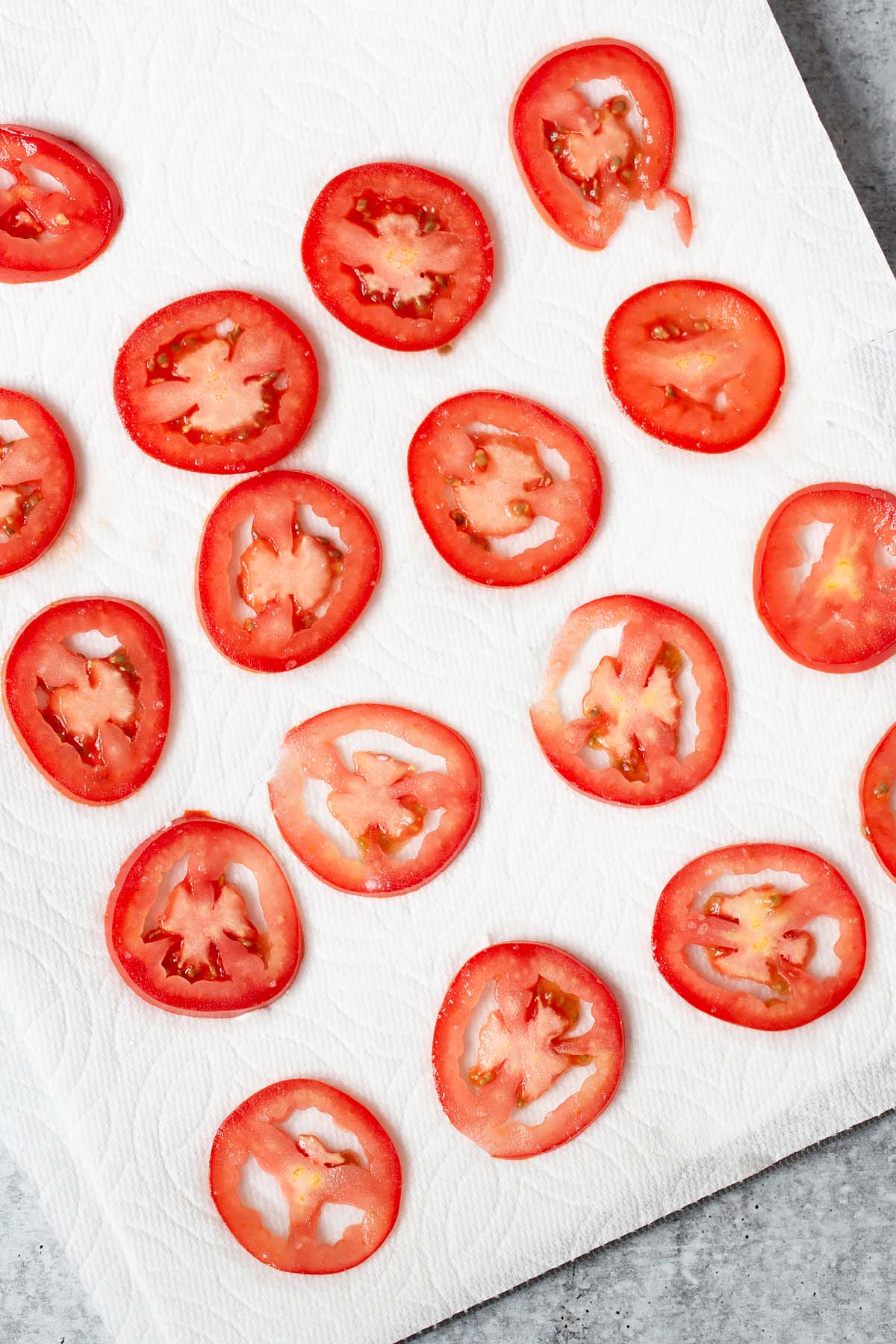 tomato slices on a paper towel