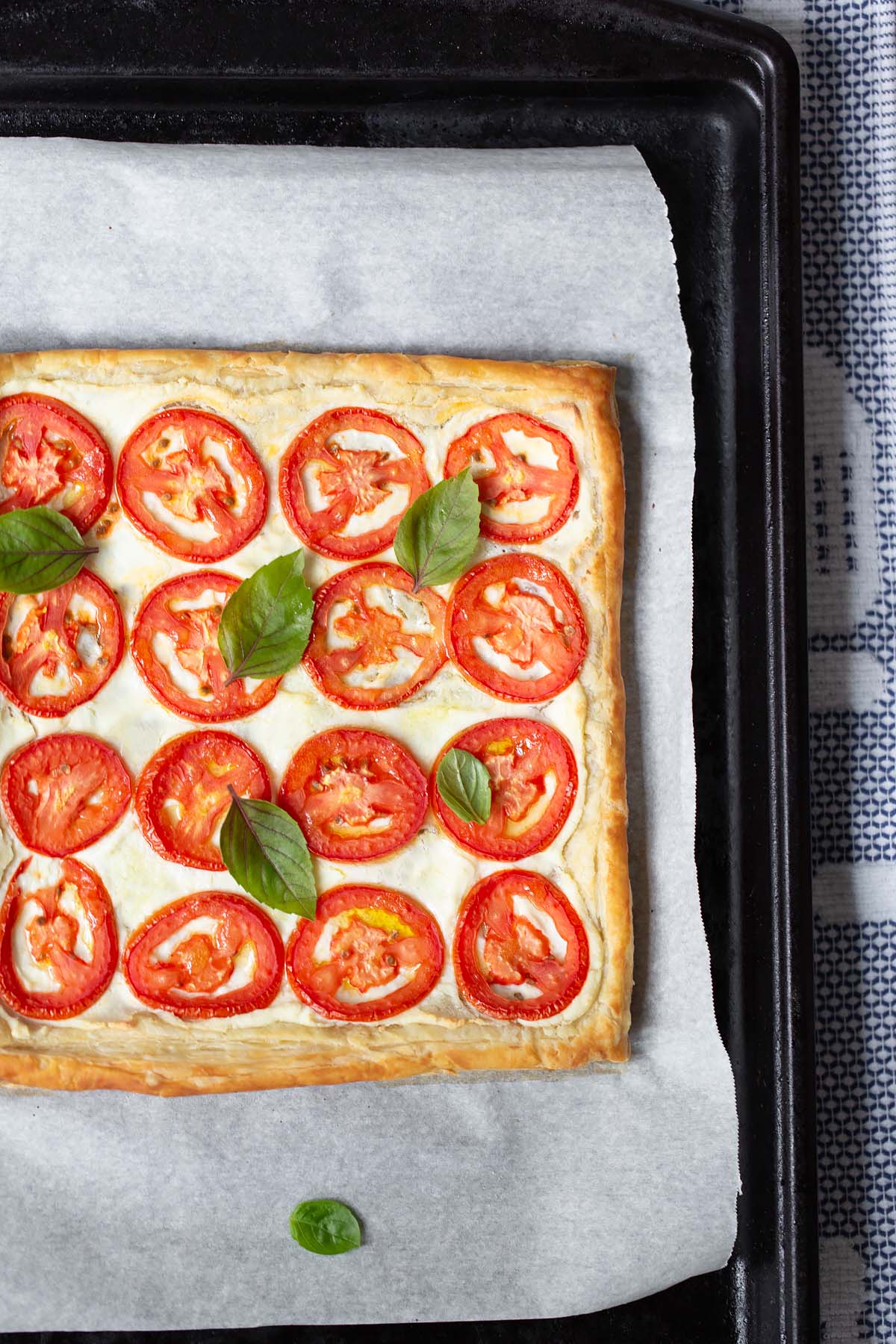 tomato and ricotta tart topped with fresh basil