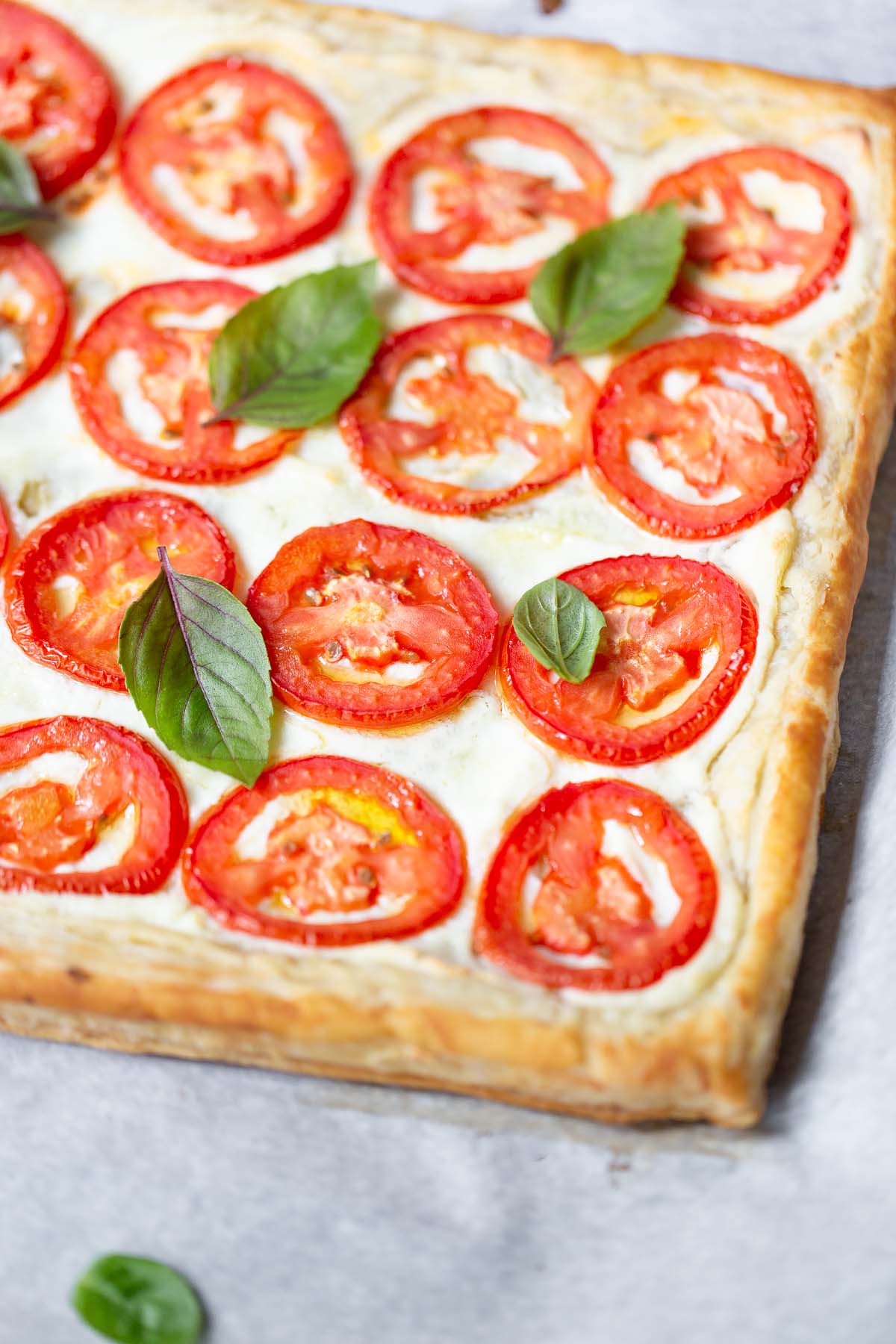 tomato and ricotta tart topped with fresh basil