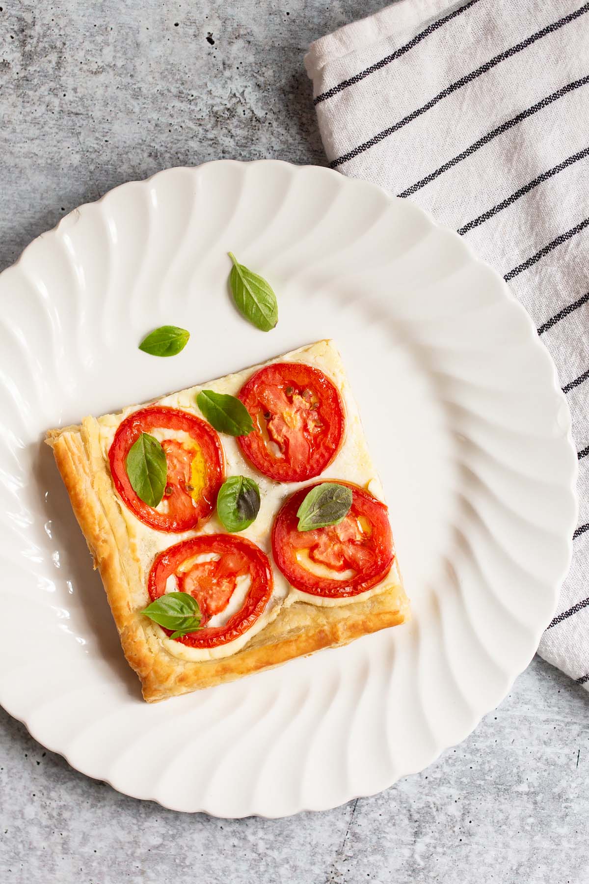tomato and ricotta tart topped with fresh basil