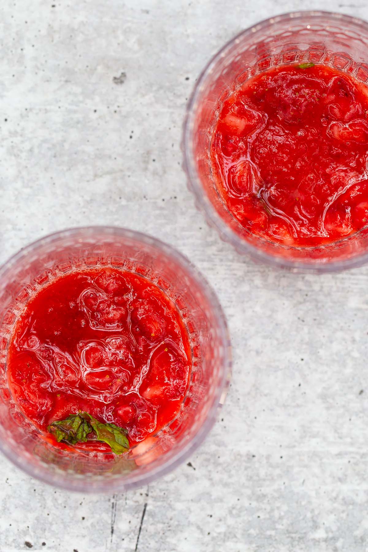 muddled strawberries and mint