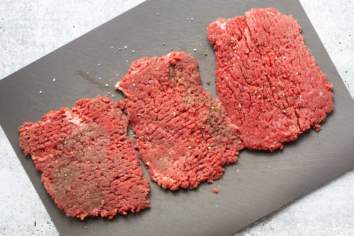 raw steak on a cutting board